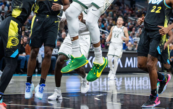 Milwaukee Bucks forward Giannis Antetokounmpo's green and yellow Nike sneakers.